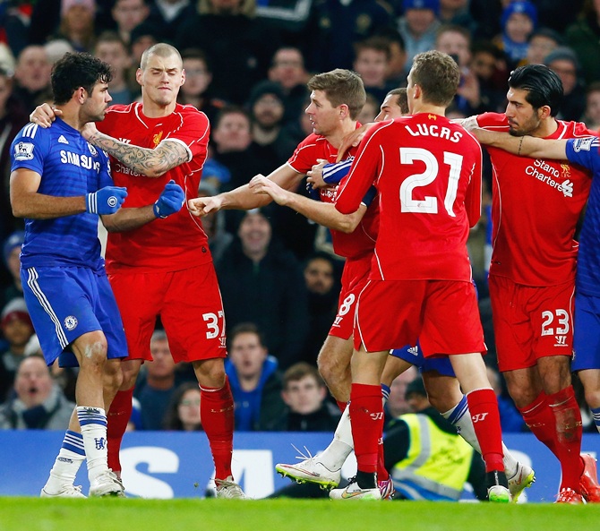 Diego Costa of Chelsea clashes with Steven Gerrard of Liverpool during the Capital One Cup Semi-Final 