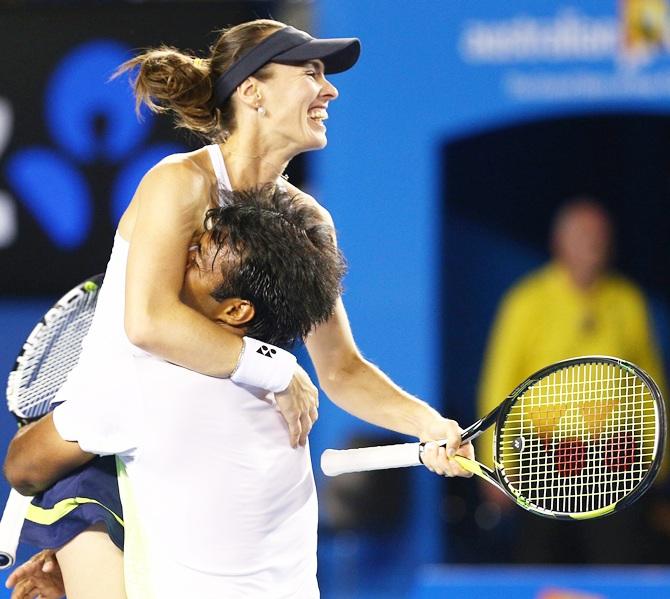 Martina Hingis of Switzerland and Leander Paes of India celebrate