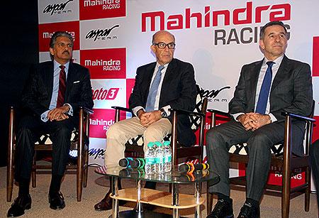 Anand Mahindra, Carmelo Ezpeleta (CEO, motoGP) and-Jorge 'Aspar' Martinez (former winner and CEO of Mahindra Racing)