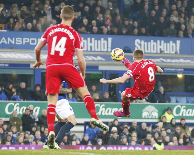 Steven Gerrard of Liverpool has a shot at the Everton goal during their English Premier League match at Goodison Park on Saturday