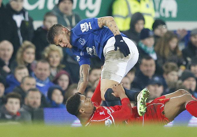 Muhamed Besic of Everton and Jordan Ibe of Liverpool are involved in a challenge