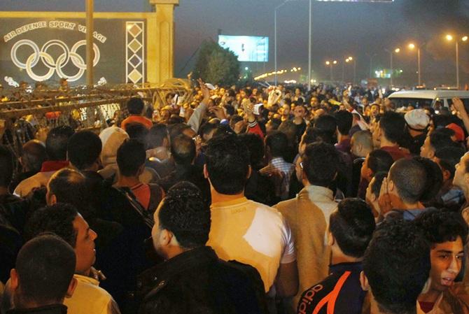 Soccer fans argue with security personnel