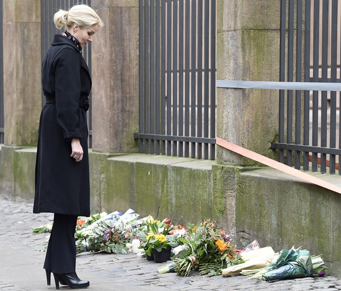 Denmark's Prime Minister Helle Thorning-Schmidt places flowers in front of the synagogue in   Krystalgade in Copenhagen
