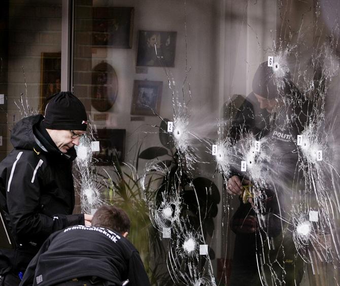  Police technicians work next to the door to Krudttoenden in Oesterbro, Copenhagen