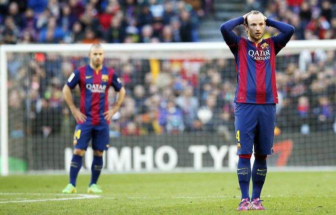 Barcelona's Ivan Rakitic (right) reacts during the La Liga match against Malaga at Camp Nou stadium in Barcelona on Saturday