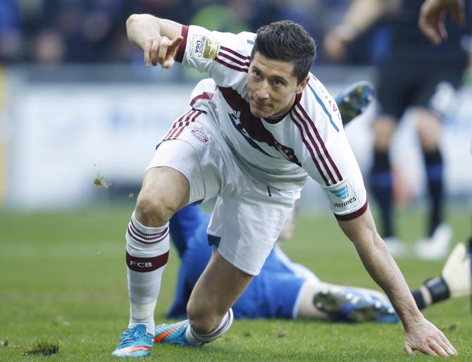 Bayern Munich's Robert Lewandowski celebrates after scoring against Paderborn during their Bundesliga match in Paderborn on Saturday