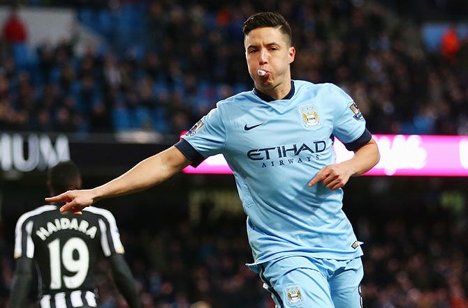 Samir Nasri of Manchester City celebrates scoring the second goal against Newcastle United during their English Premier League match at Etihad Stadium in Manchester on Saturday