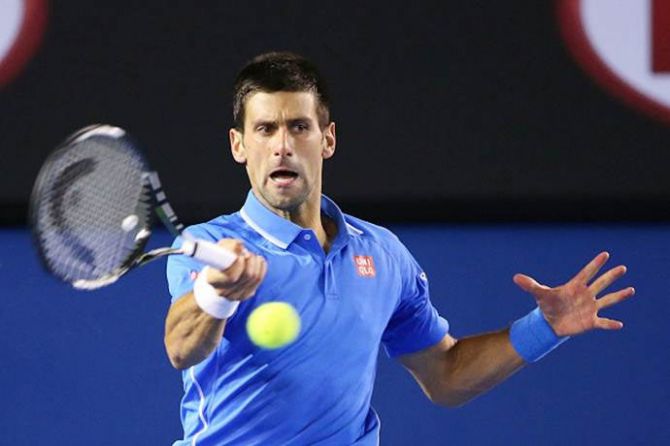 Novak Djokovic of Serbia plays a forehand during his semi-final match against Stanislas Wawrinka of Switzerland at the Australian Open