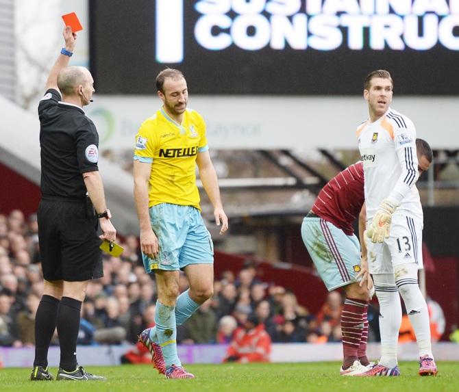 Crystal Palace's Glenn Murray looks dejected as he receives a second booking and a red card   from referee Mike Dean