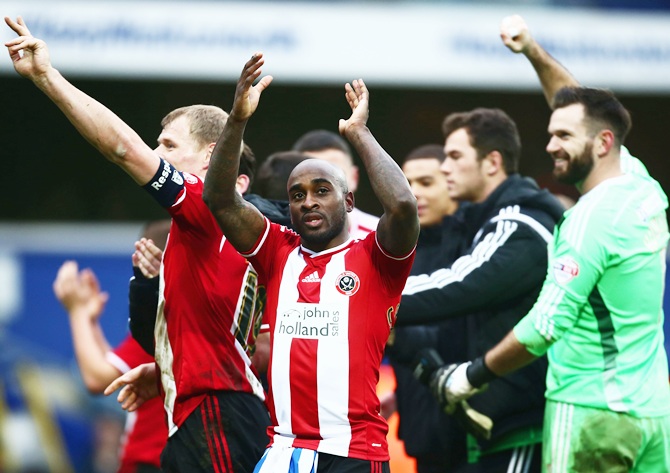 Jamal Campbell-Ryce of Sheffield United, centre, celebrates victory with team mates after the FA Cup third round match against Queens Park Rangers
