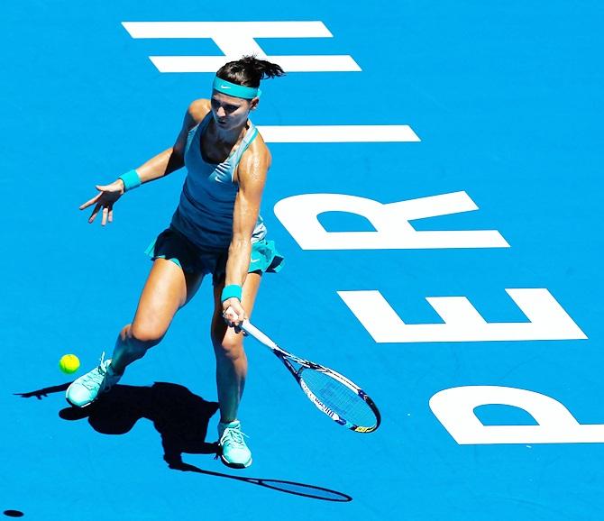 Lucie Safarova of the Czech Republic plays a forehand to Eugenie Bouchard of Canada