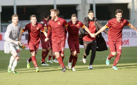 AS Roma players celebrate victory after defeating Udinese Calcio in their Serie A match at Stadio Friuli in Udine on Tuesday