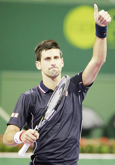 Novak Djokovic of Serbia reacts after wining his match against compatriot Dusan Lajovic at the Qatar Open tennis tournament in Doha on Tuesday