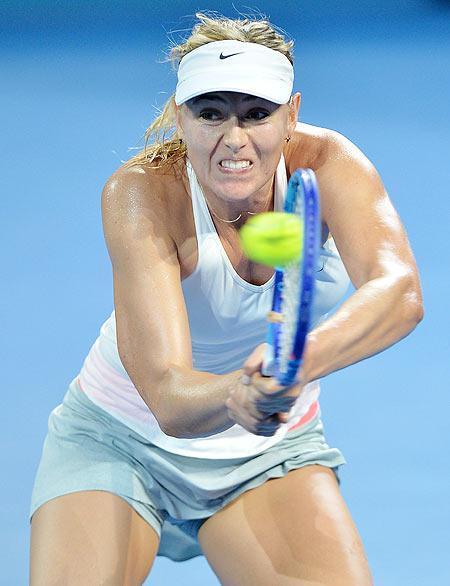 Maria Sharapova of Russia plays a backhand against Yaroslava Shvedova of Kazakhstan during the 2015 Brisbane International at Pat Rafter Arena in Brisbane on Tuesday