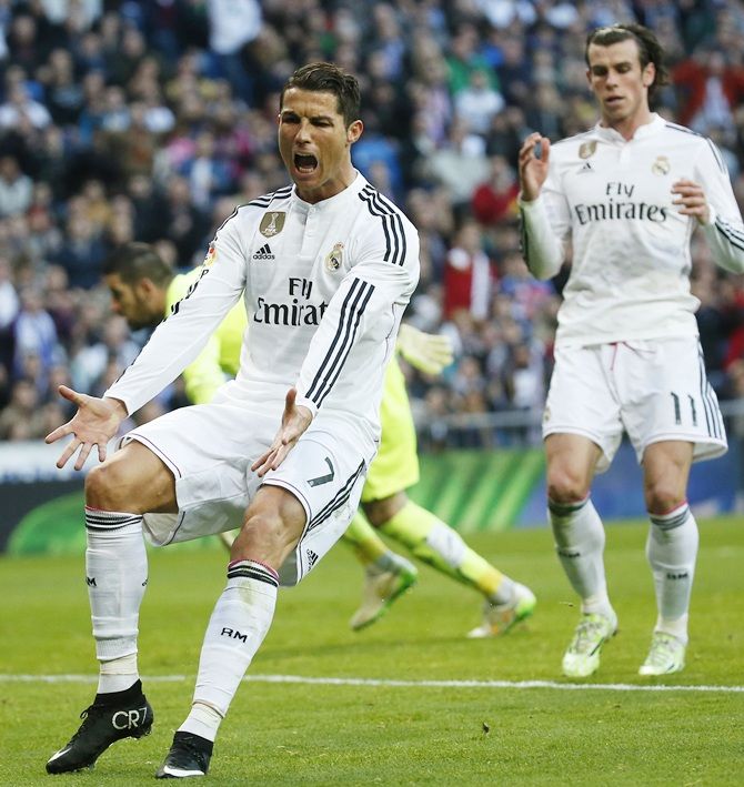 Real Madrid's Cristiano Ronaldo reacts, left, next to his teammate Gareth Bale