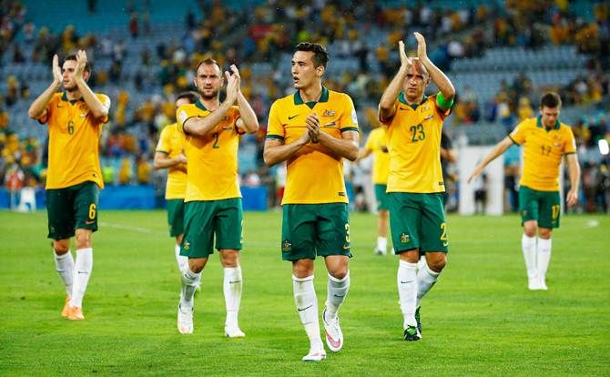 (Left to right) Matthew Spiranovic, Ivan Franjic, Jason Davidson and Marco Bresciano of Australia acknowledge the crowd after the 2015 Asian Cup match against Oman at ANZ Stadium in Sydney.