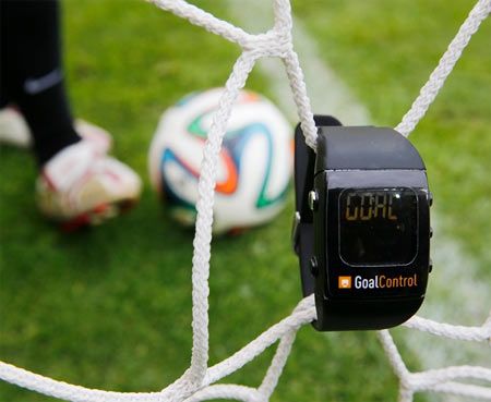  Image: A GoalControl watch reads "goal" as a football rolls fully behind the goal line during a demonstration in the western German city of Aachen