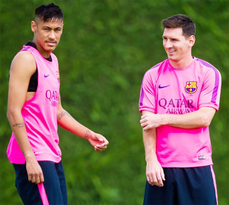 Neymar, left, and Lionel Messi look on during a FC Barcelona training session