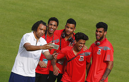 Equatorial Guinea's players pose for a selfie on the field