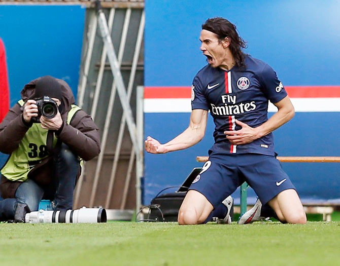 Paris St Germain's Edinson Cavani celebrates after scoring against Evian Thonon Gaillard during their French Ligue 1 match at Parc des Princes stadium in Paris on Sunday