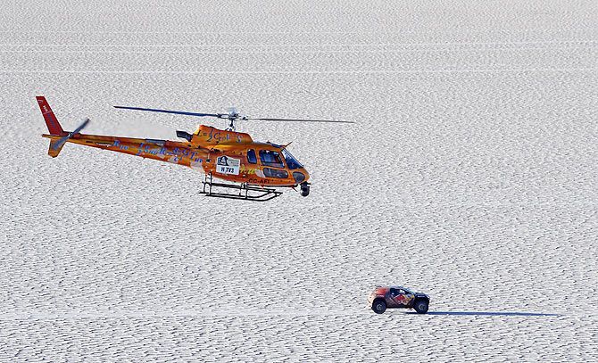 Peugeot driver Stephane Peterhansel of France drives on the Salar de Uyuni salt flat during the 8th stage of the Dakar Rally 2015, from Uyuni to Iquique, Bolivia on January 11