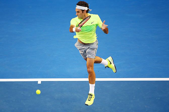 Roger Federer of Switzerland plays a forehand in his first round match against Yen-Hsun Lu of Chinese Taipei at the 2015 Australian Open at Melbourne Park on Monday