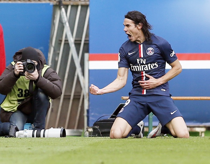 Paris St Germain's Edinson Cavani celebrates after scoring against Evian Thonon Gaillard during their French Ligue 1 match at Parc des Princes stadium in Paris