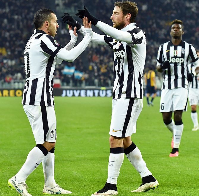Carlos Tevez, left, of Juventus FC celebrates