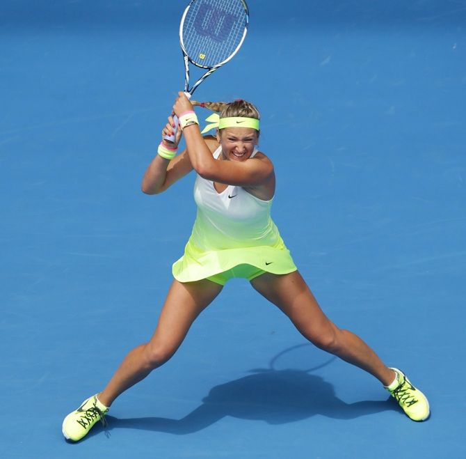 Victoria Azarenka of Belarusplays a backhand in her first round match against Sloane Stephens of the United States