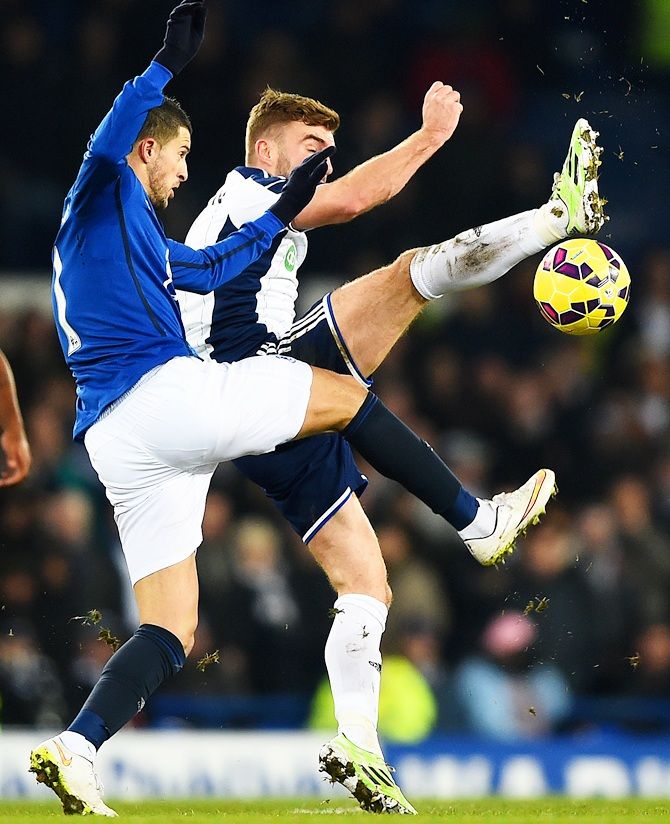 James Morrison of West Brom battles for the ball with Kevin Mirallas of Everton
