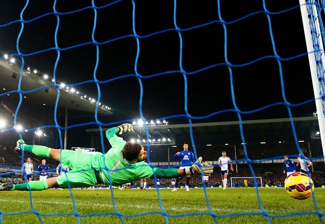 Ben Foster of West Brom dives as Kevin Mirallas of Everton fails to score from the penalty spot