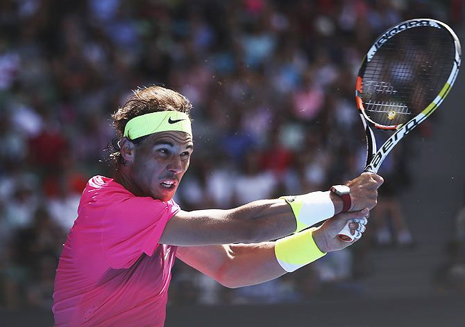 Rafael Nadal of Spain plays a forehand in his first round match against Mikhail Youzhny of Russia on Tuesday