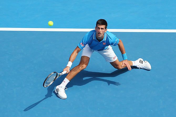 Novak Djokovic of Serbia plays a backhand against Aljaz Bedene of Slovenia in his first round match of the 2015 Australian Open at Melbourne Park on Tuesday