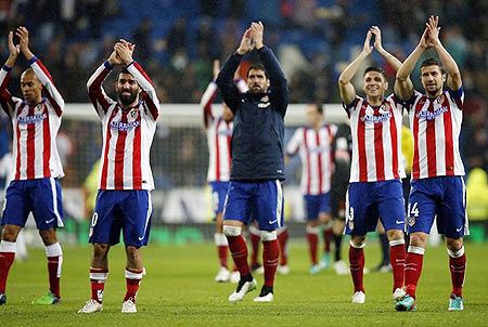 Atletico Madrid players celebrate a win 