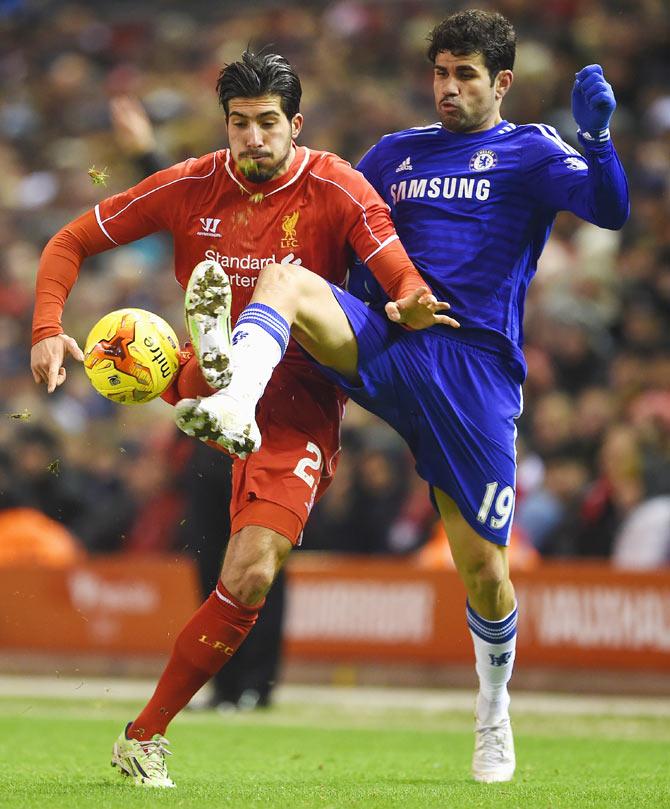 Emre Can of Liverpool and Diego Costa of Chelsea vie for possession