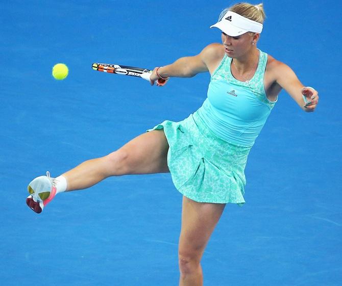 Caroline Wozniacki of Denmark in action during her second round match against Victoria Azarenka of Belarus 