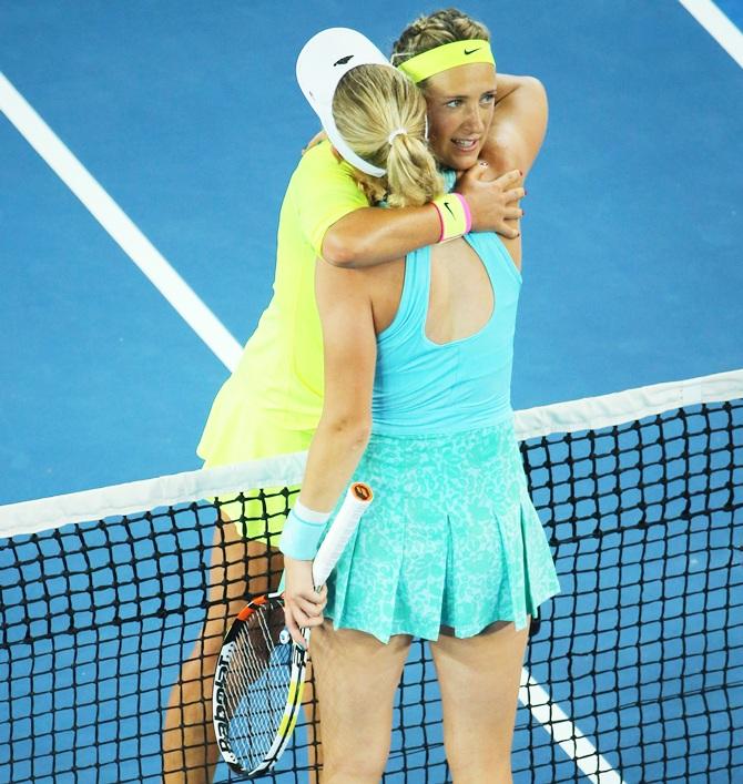 Victoria Azarenka of Belarus is congratulated by Caroline Wozniacki of Denmark 