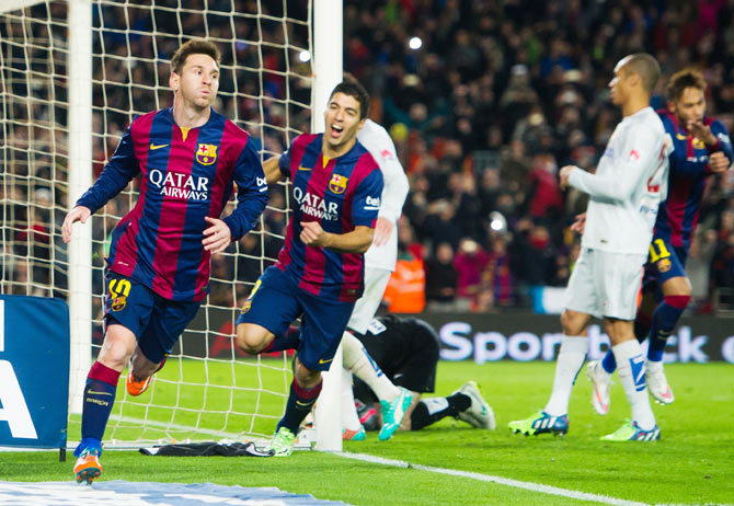 Lionel Messi celebrates after scoring against Atletico de Madrid during their Copa del Rey quarter-final first leg match at Camp Nou on Wednesday