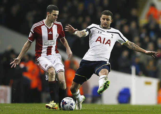 Tottenham Hotspur's Kyle Walker challenges Sheffield United's Jamie Murphy (left)