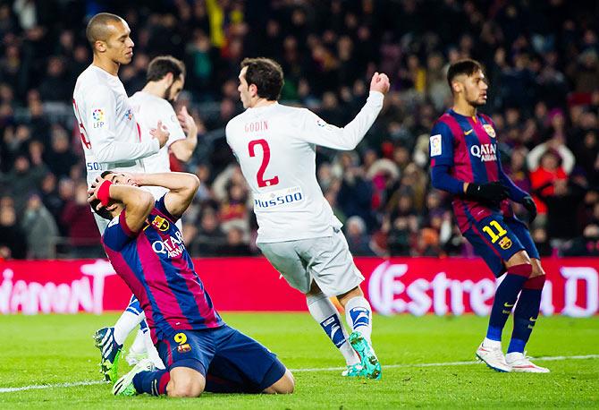 Luis Suarez of FC Barcelona reacts after missing a scoring opportunity