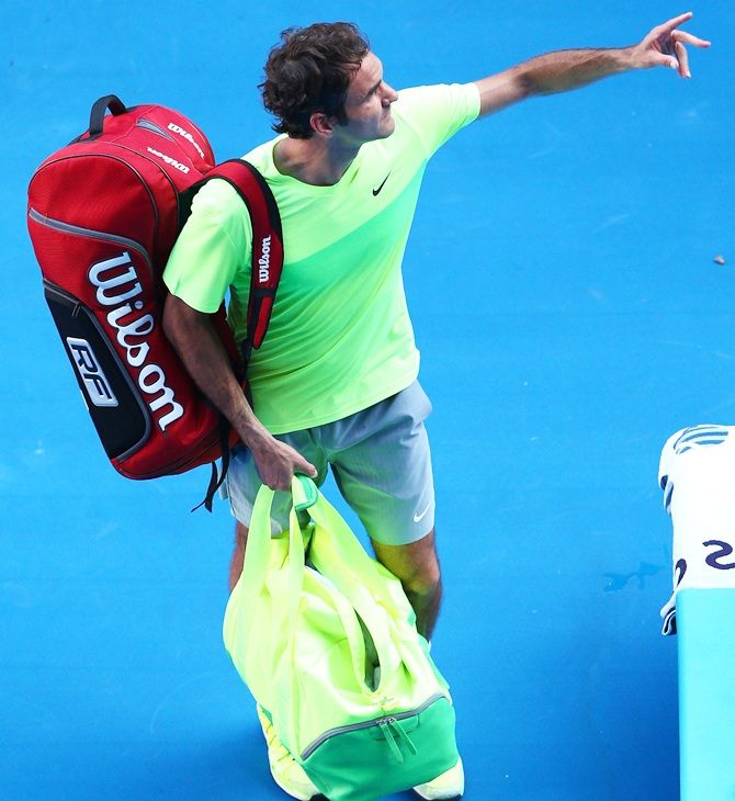 Roger Federer of Switzerland leaves the court after losing his third round match against Andreas Seppi of  Italy