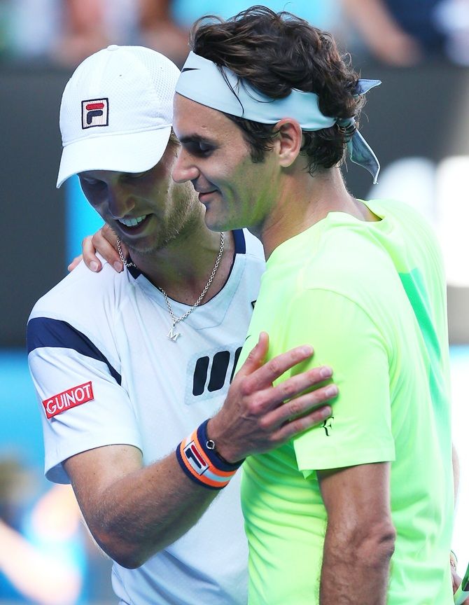 Roger Federer of Switzerland shakes hands with Andreas Seppi of Italy 