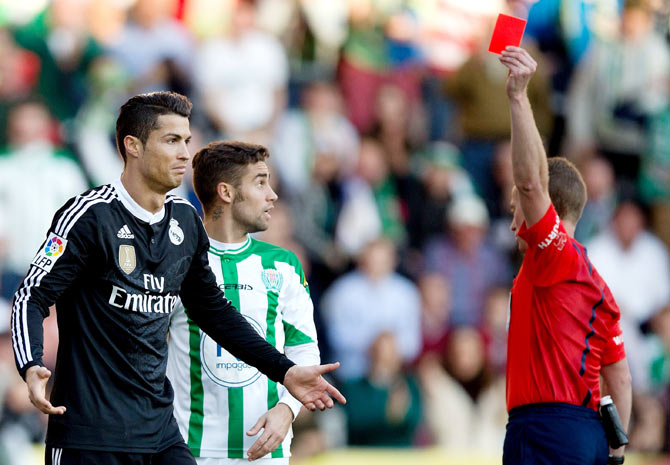 Referee Hernandez Hernandez (right) shows the red card to Cristiano Ronaldo of Real Madrid during the La Liga match between Cordoba CF and Real Madrid at El Arcangel stadium in Cordoba, Spain, on Saturday