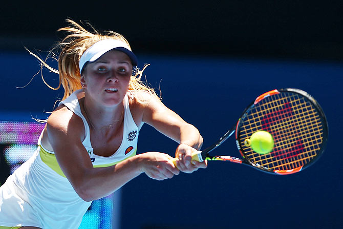 Elina Svitolina of the Ukraine plays a backhand in her third round match against Serena Williams of the United States