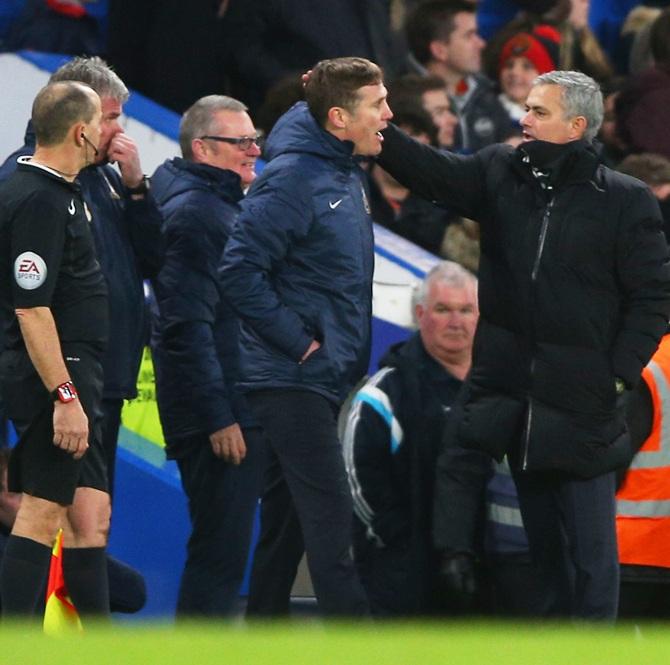 Phil Parkinson the manager of Bradford City is congratulated by Jose Mourinho manager of Chelsea