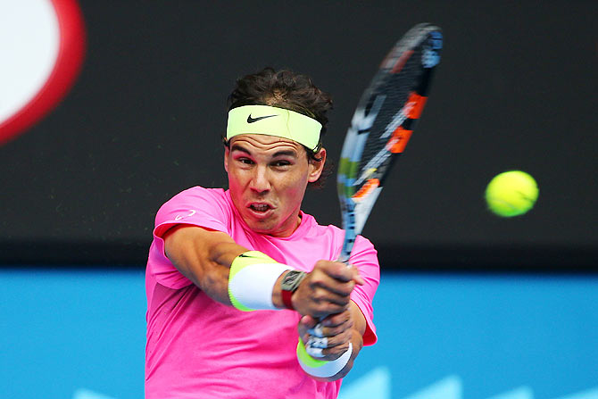 Rafael Nadal plays a backhand in his quarter-final against Tomas Berdych