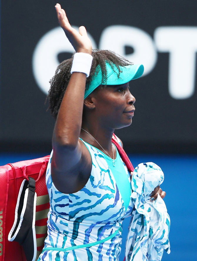 Venus Williams of the United States leaves the court after losing her quarterfinal match against Madison Keys