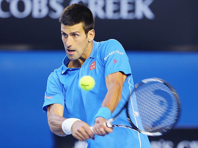Novak Djokovic of Serbia plays a backhand in his quarter-final match against Milos Raonic of Canada at the 2015 Australian Open at Melbourne Park on Wednesday