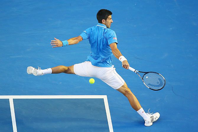 Novak Djokovic of Serbia plays a backhand in his quarter-final match against Milos Raonic of Canada during the 2015 Australian Open at Melbourne Park on Wednesday