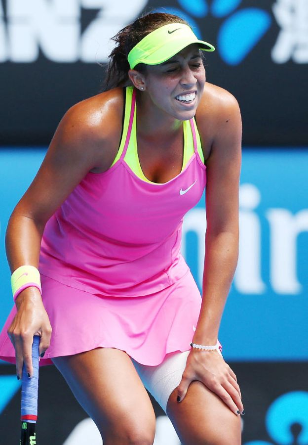 Madison Keys of the United States grimaces in pain as he clutches on to her thigh